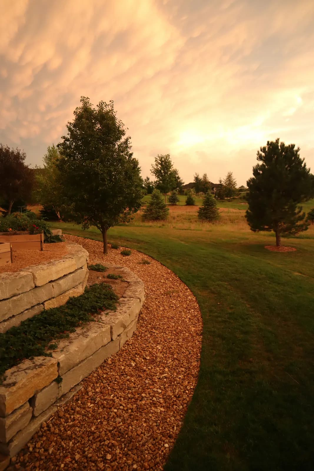 Sunset over a Hampshire garden with stone border